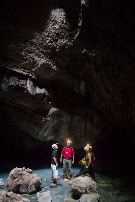 people exploring caves