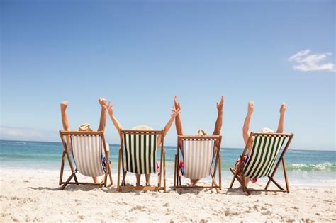 people sitting in beach chairs