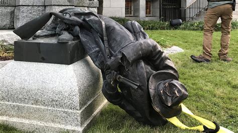 people tearing down statues
