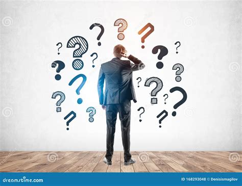 a person looking up at a cloud of question marks