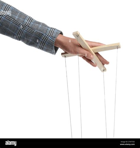 person trying to control a puppet with strings
