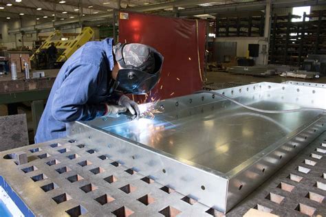 person working with sheet metal