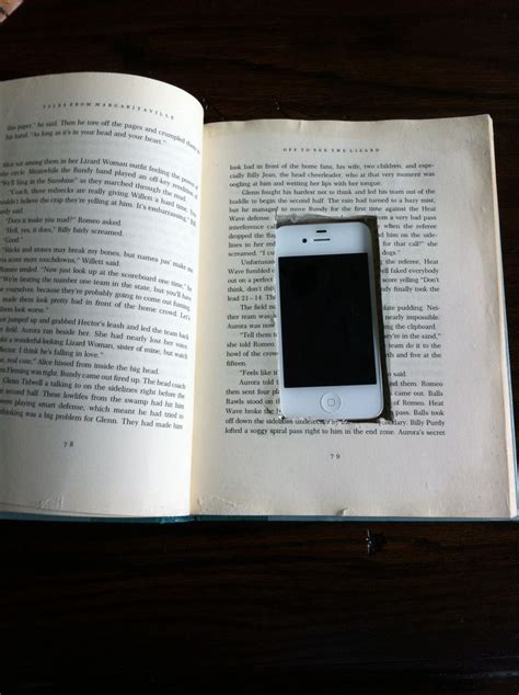 phone behind book