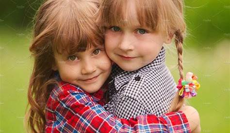 Two Young Children Hugging Outdoors Royalty Free Stock Images - Image