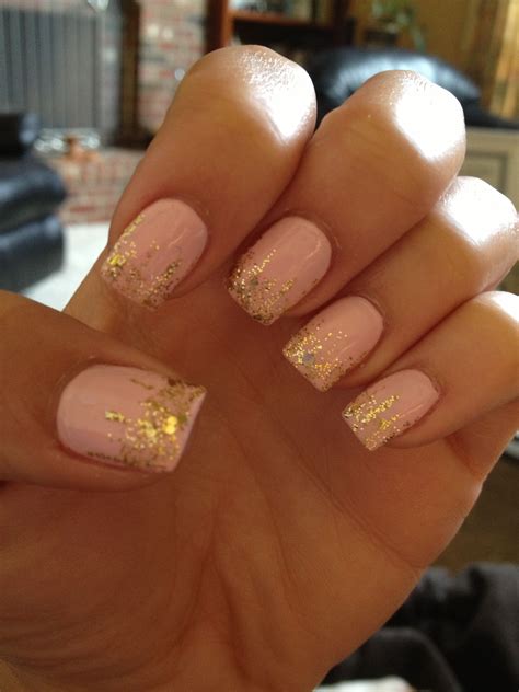 Pretty baby pink and gold glitter nails. Simple, but cute. Gold