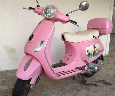 The Hidden Charms of the Pink Moped: A Unique Urban Ride