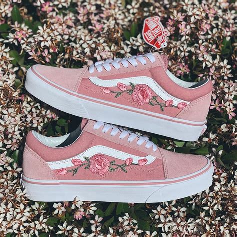 pink vans with roses on the side