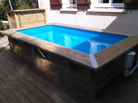 Construction piscine 7x4m terrasse bois et carrelage mosaïque Lyneo
