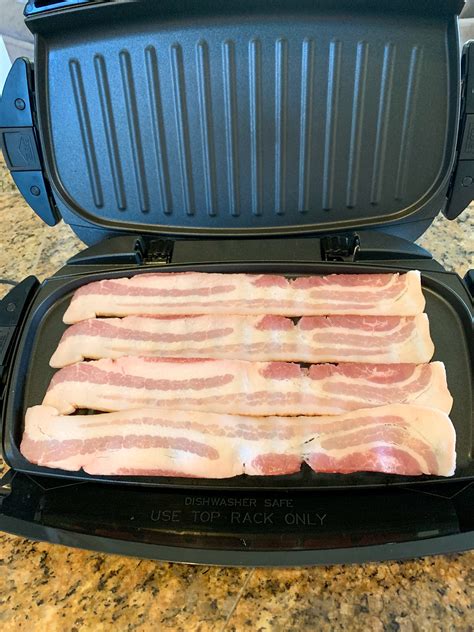 Placing bacon strips on George Foreman grill