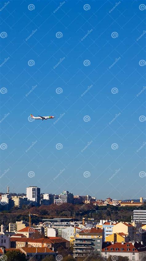 plane flying over lisbon