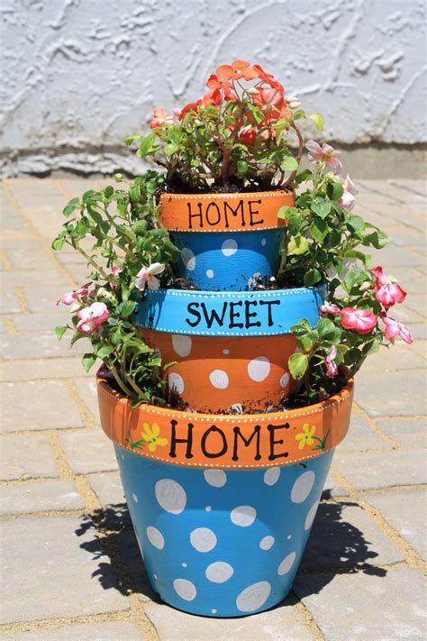Painted flower pots Decorated flower pots, Flower pots, Painted