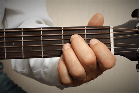 playing guitar with short fat fingers