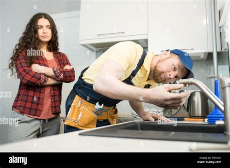 plumber checking a faucet