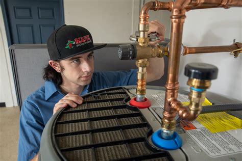 plumber checking a water heater