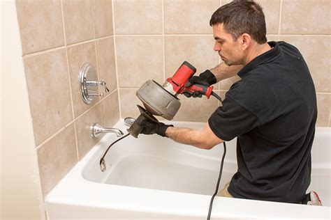 Plumber Clearing a Clogged Drain in Escondido