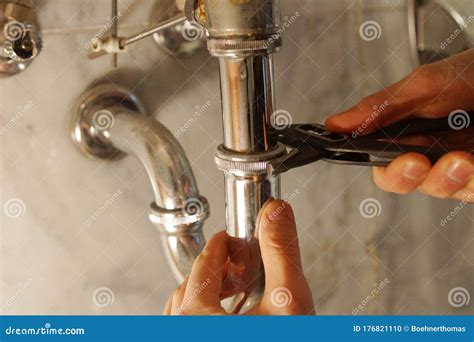Plumber fixing drain
