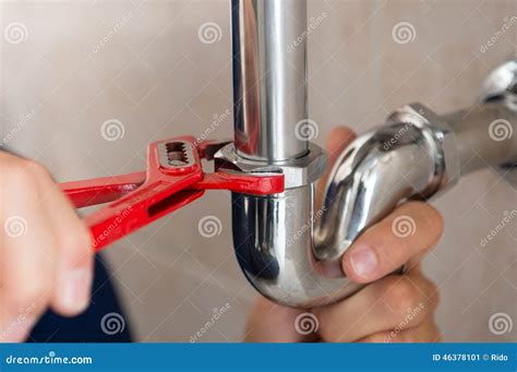 Plumber fixing pipe