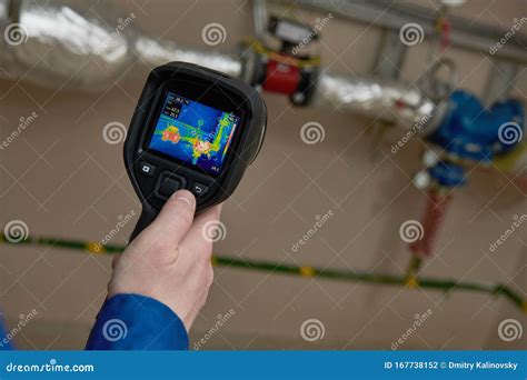 plumber using thermal imaging camera