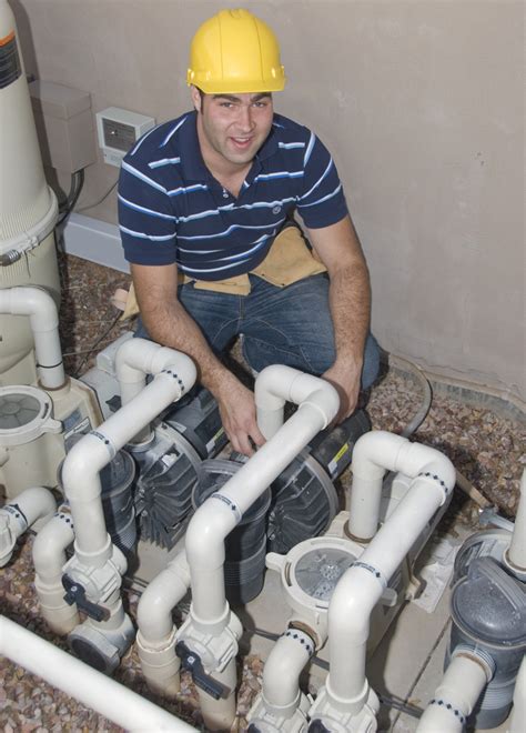 Pool repair technicians at work