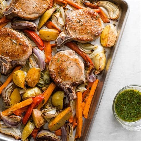 Pork Chops With Veggies In A Roasting Pan