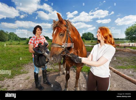 preparing for a horseback ride