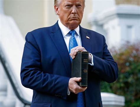 president trump holding bible at church