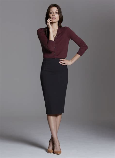 The ultimate professional womens outfit is composed of a navy pencil