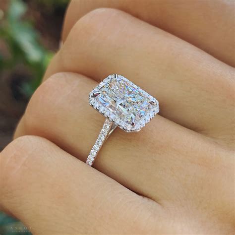 radiant cut with halo engagement rings
