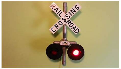 Flashing warning lights at a railway crossing near