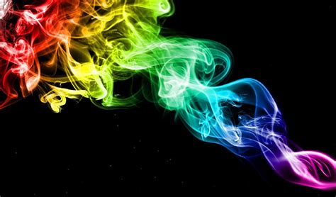 Vibrant and Striking: Discover the Mesmerizing Rainbow Smoke against a Black Background!