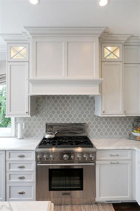 range hood designs between cabinets