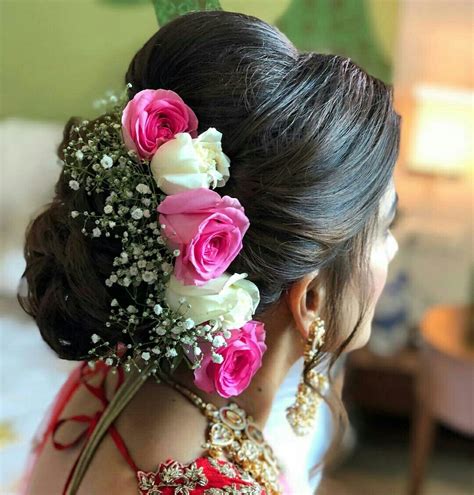 What a beautiful large low bun with real flower gajra! Care however