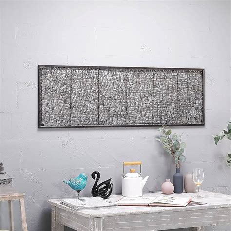 Rectangular metal wall art in a kitchen