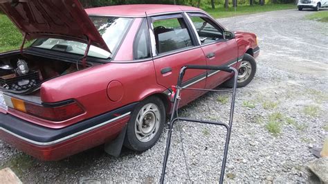 A Red Ford Tempo GL Sedan In China