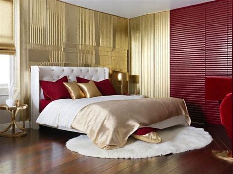 Bedroom with Red and Gold Striped Wall and Chandelier Burgundy