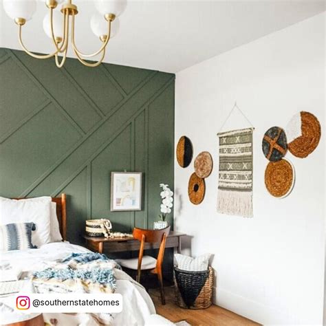 Relaxing bedroom with dark green accent wall