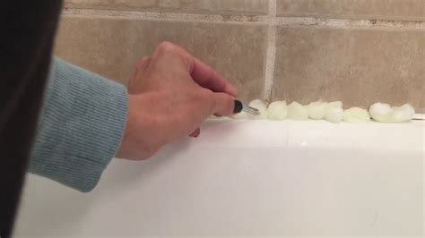 remove grout around bathtub