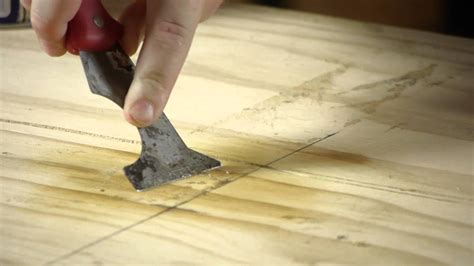 removing tape adhesive from hardwood floors
