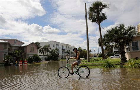 riding bicycle backward through hurricane