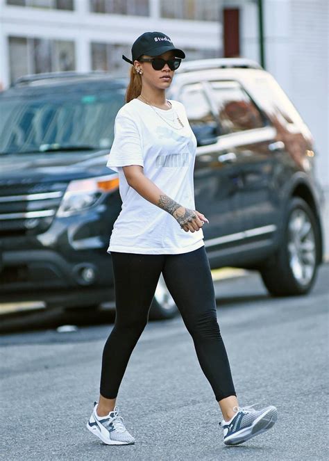 Rihanna looks downcast at the gym as police search for