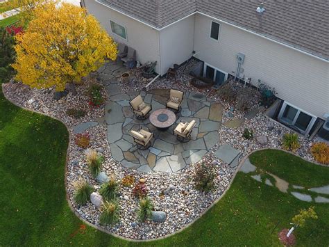 Large Stone Patio with Colorful Rock Bed Edging Oasis Landscapes