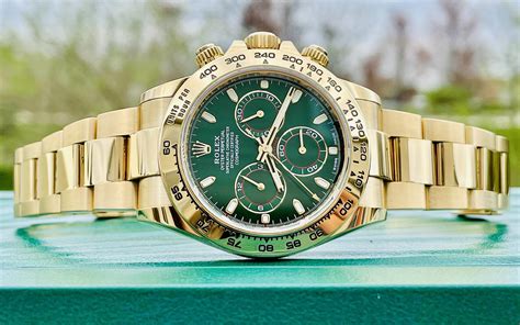 rolex daytona green face gold band