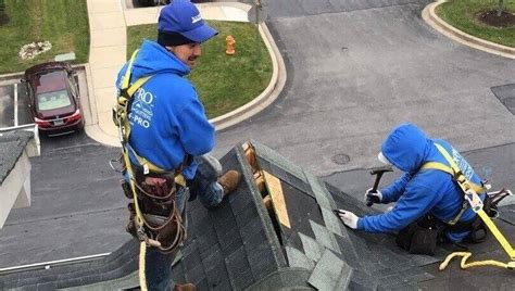 Roofers fixing a leak