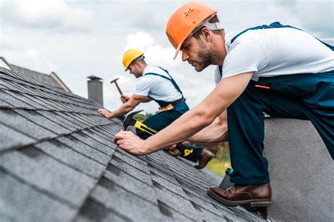 Roofing contractor fixing roof