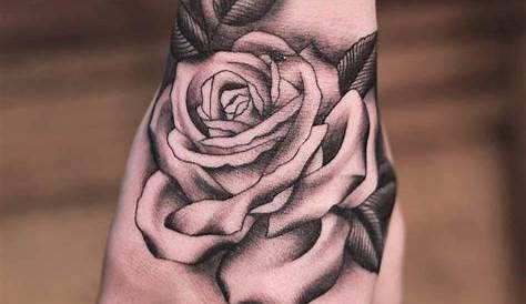 Classically placed rose hand tattoo by Lachie Grenfell