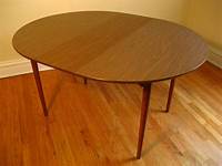 Vintage MCM Teak Round Dining Table with a Butterfly Leaf bananalab
