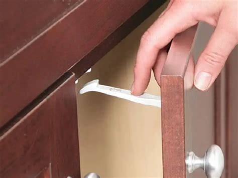 safety first cabinet latch removal