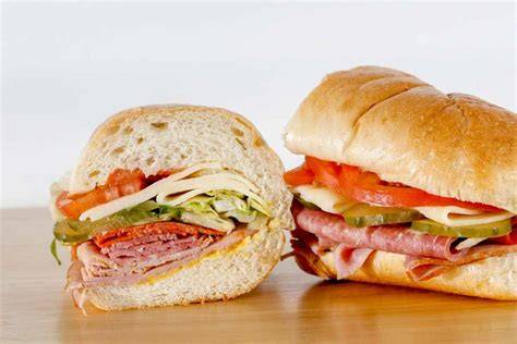 Moldy Sandwich with Salami, Tomatoes on a Chopping Board Stock Photo