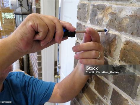 screwing into brick