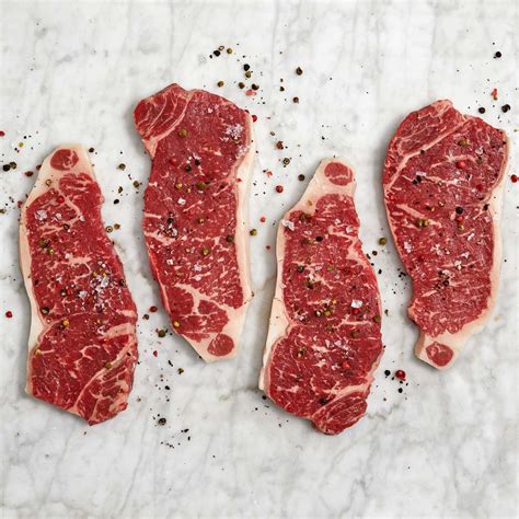 Searing thin-sliced beef loin New York strip